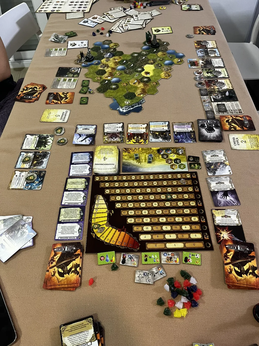 The full Mage Knight table: hex map, fame board and fans of cards
