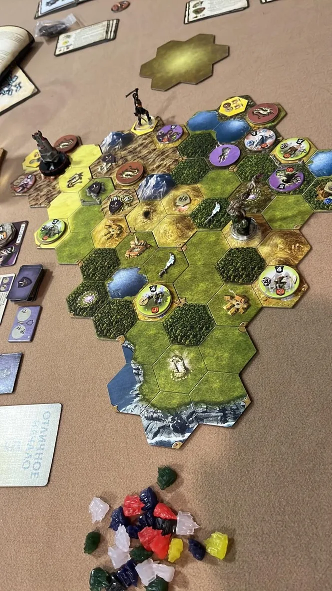 Our Mage Knight session: the hex map with hero miniatures and enemy tokens