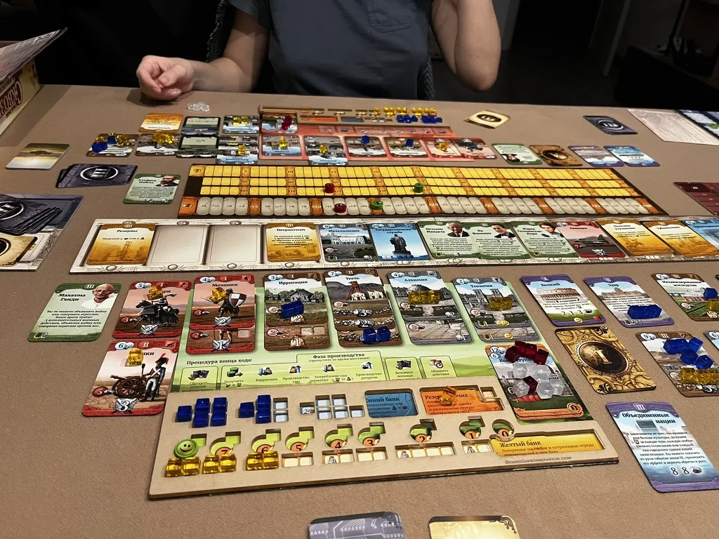 Our Through the Ages session: card rows, a civilization board and resource cubes