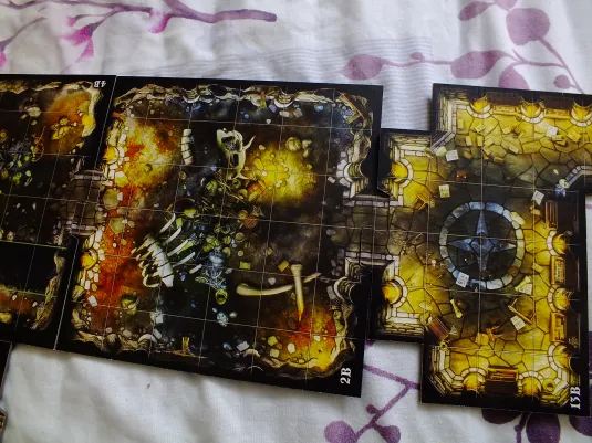 Dungeon map tiles assembled: fiery caverns, stone halls, and treasure rooms