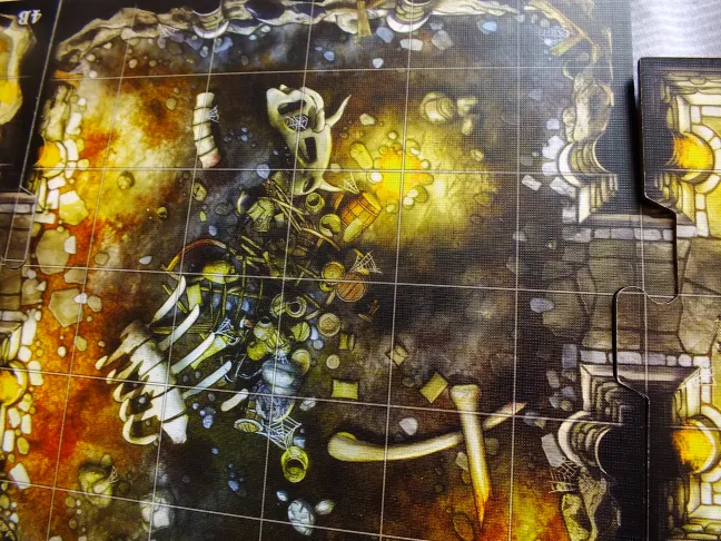 Close-up of a dungeon tile with scattered treasure and skeleton details